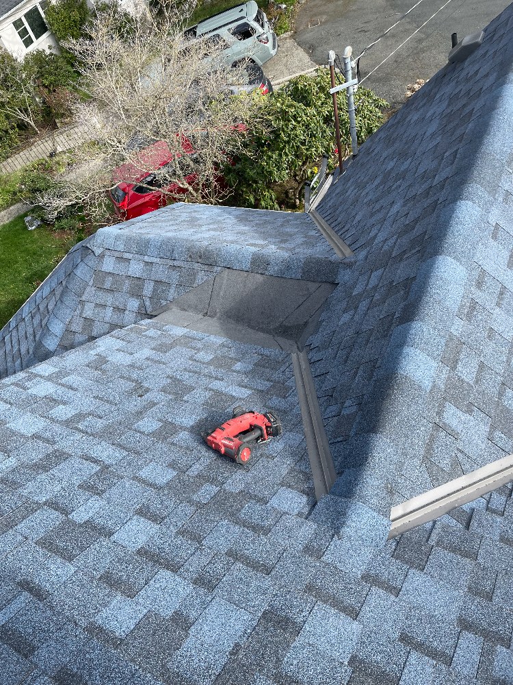 Finished architectural shingle roof with ridge and valley detailing